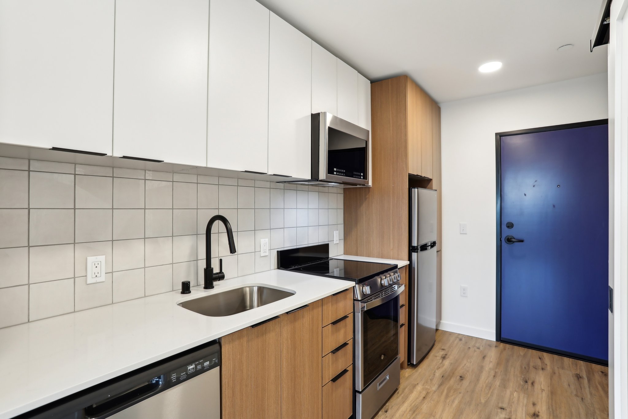 Carrick unit interior kitchen and entrance door